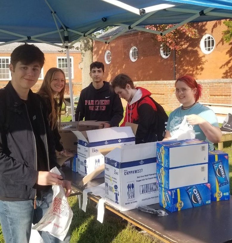 Students (left to right), Ethan Rychling, Riley DeForest, Rabeeh Mahmoud, Robert Martin, and Gianna Fedo help prepare food for Veterans at Stand Down Day in Rocky Hill. The phrase Stand Down means that Veterans are provided a metaphorical break and others, like these students, will honor them with their own service. (Courtesy Photo)